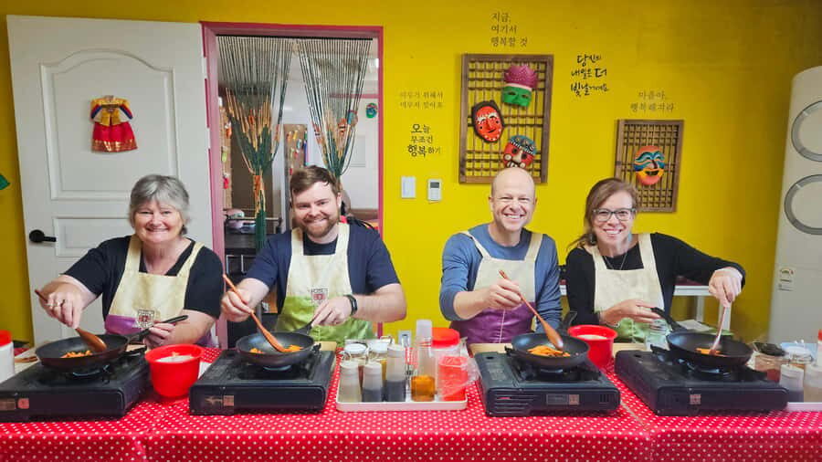 Seoul: Korean Cooking Class at a Local Home and Market Tour - Welcome tea, Korean phrases, and the Tal mask cultural moment